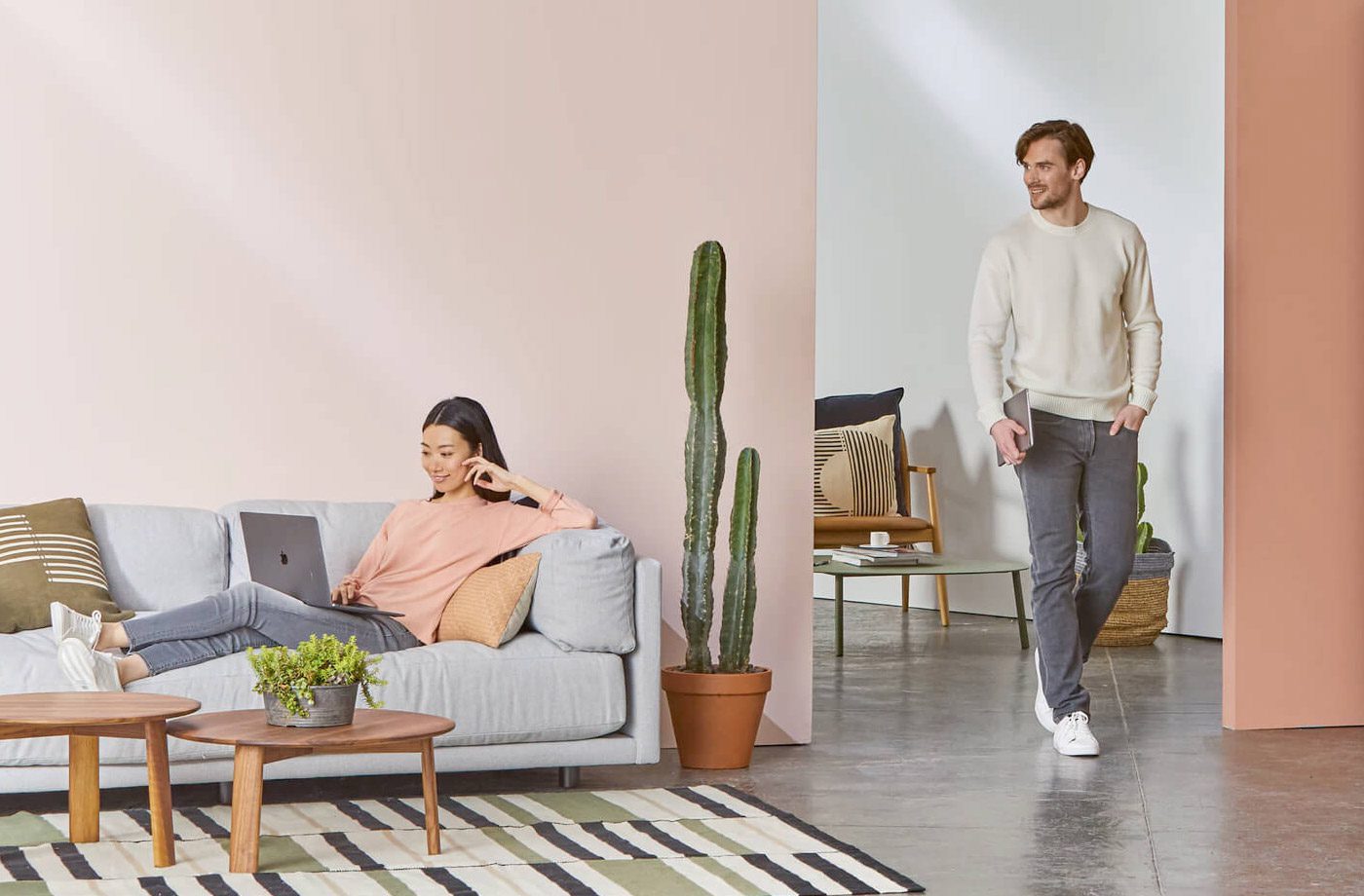 Man and woman relaxing in modern living room.