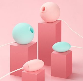 Colorful modern devices on pink geometric blocks.