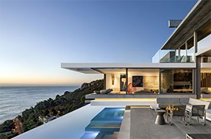 Modern cliffside house with ocean view.
