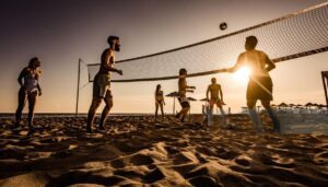 People playing beach volleyball at sunset.